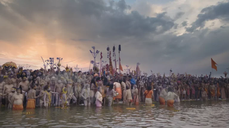 Image of saints and sadhus doing shahi snan or royal bath in kumbh mela